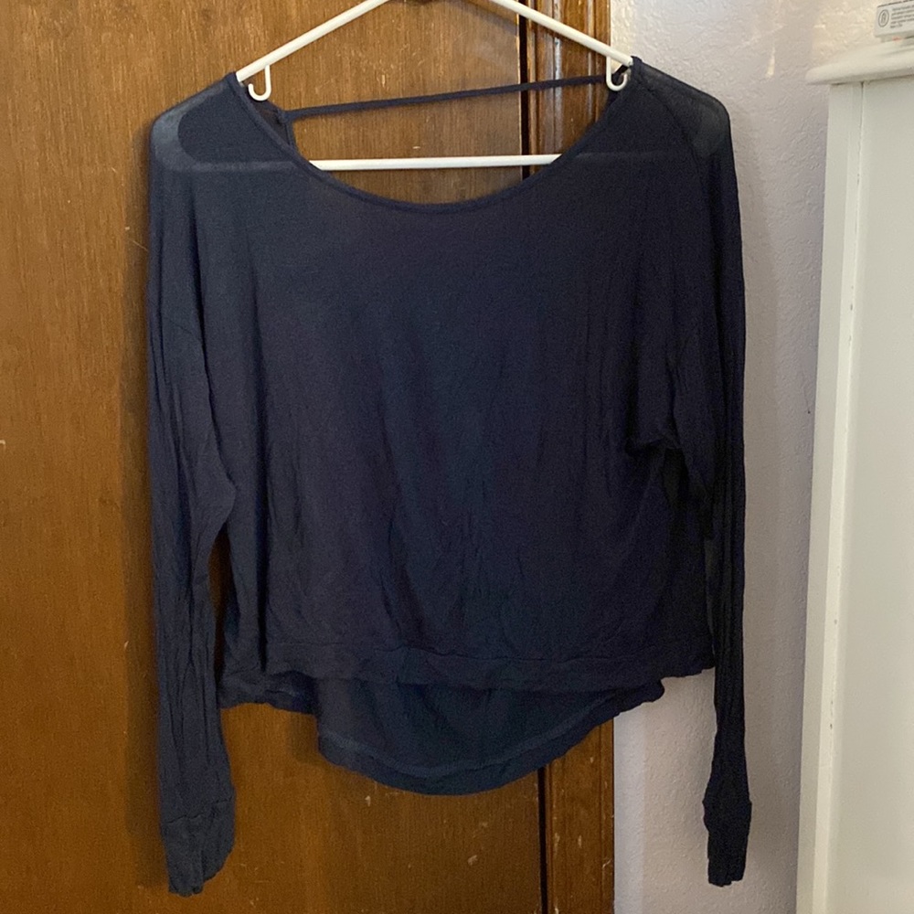 Small navy blue long sleeve shirt with slightly open back